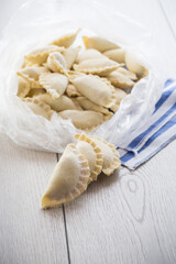 Raw dumplings with filling inside, Ukrainian cuisine.