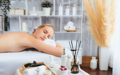 Caucasian woman customer enjoying relaxing anti-stress spa massage and pampering with beauty skin...