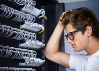 Server room, thinking and confused man with cables for connectivity, night and check hardware. Cybersecurity system, it network and technician for glitch, data center and problem solving for error