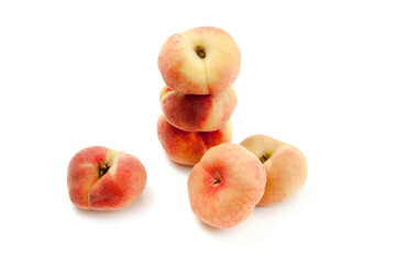 Several saturn peaches or flat peaches isolated on white background with clipping path.. © kostik2photo