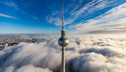 Gordijnen Bird's-eye View of the Television Tower Piercing Through the Clouds in Berlin © Tatiana