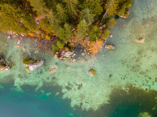 Top view to Bavarian forest autumn nature landscape with crystal clear water at lake 