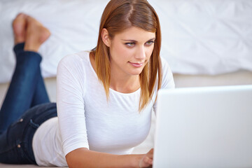 Woman, remote work and relax on floor with laptop to update blog post, social media and digital news subscription at home. Freelancer typing on computer for online shopping, editing email or research