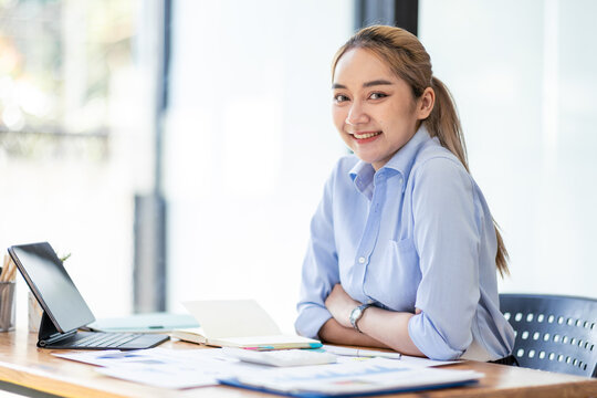 working about how to take the business to technological heights. Cropped shot of an attractive young business asian woman working in her office.