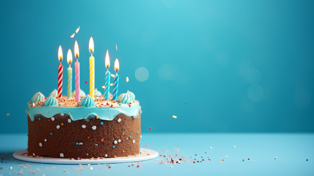 Yummy birthday cake with candles on light blue background