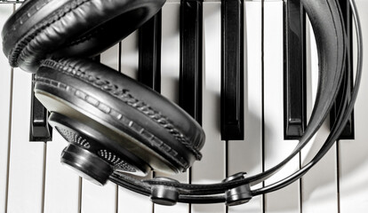 Headphones and piano keyboard