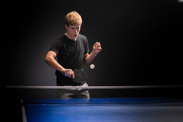 Portrait of young man playing tennis