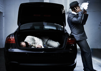 Crime, car and man with hostage in trunk for negotiation, kidnapping ransom and phone call. Mafia,...