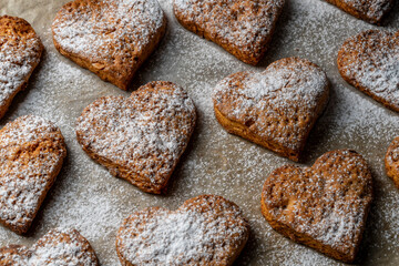 Home made heart shaped shortbread cookies on baking tray