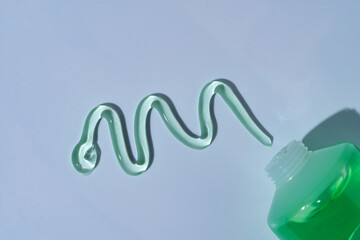 A green swatch of aloe gel, texture presentation sample