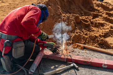 Welding hardware to lay the foundation