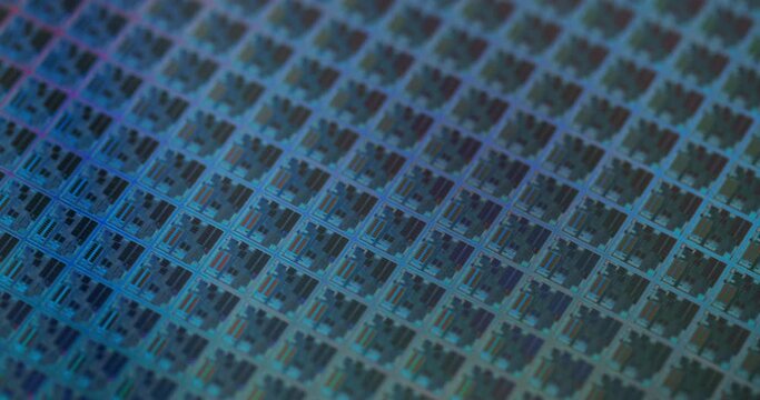 Macro Shot of a Silicon Wafer with Computer Chips during Manufacturing Process at Fab or Foundry. Semicondutor Wafer Texture.