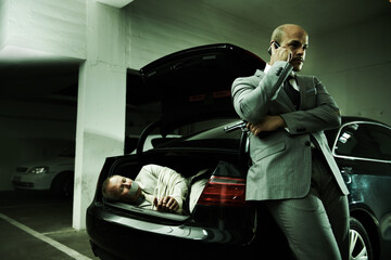 Phone call, ransom and man with hostage in car for negotiation, kidnapping danger and crime. Mafia,...
