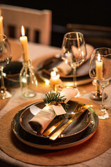 winter holidays, dinner party and celebration concept - close up of scandinavian christmas table serving with burning candles at home at night - obrazy, fototapety, plakaty