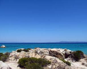 Fototapeta na wymiar Panorama of white rocks, blue sky and blue sea. Summer concept.