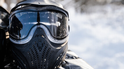 Paintball mask in winter on the street, free space to insert