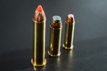 Macro photo, magnum class cartridges for revolvers and pistols, 45-70, 44 magnum, 357 magnum.