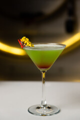 Alcoholic cocktail on a black background. Concept of cocktails and alcohol
