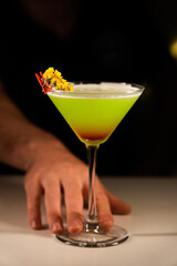 Alcoholic cocktail on a black background. Concept of cocktails and alcohol