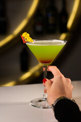 Alcoholic cocktail on a black background. Concept of cocktails and alcohol