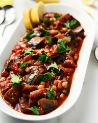 Maghmour or Lebanese moussaka. Dish made from baked or fried eggplant with spices, chickpeas and...