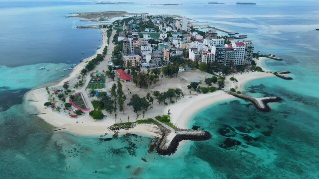 Aerial View of the Maafushi on Kaafu Atoll. Paradise Island with clear ocean water and paradise coastline, Maldives