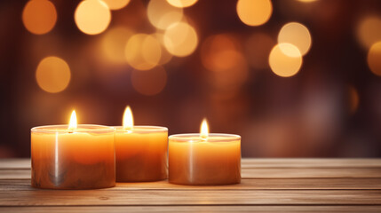 Fototapeta na wymiar Burning candles on cozy wooden table 