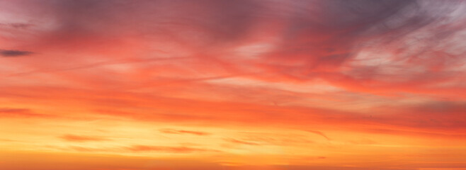 Wide-format, red sunset or sunrise, sky with a multitude of vibrant color shades. - Powered by Adobe