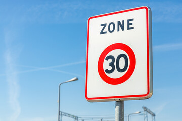 Zone 30 road sign, indicating the limit zone of thirty kilometers per hour for cars and other vehicles
