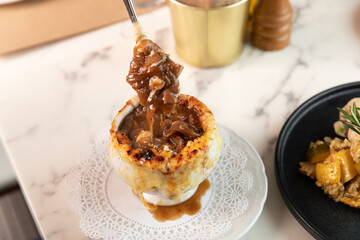 French onion soup with cheese pull