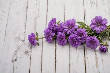 Fototapeta na wymiar purple flowers tied white wooden surface
