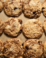 Halva Cookies with chocolate on baking pan.