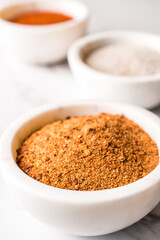 A white bowl of a red spice