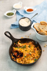 Cheese dip with bread in a cast iron pan