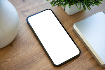 phone with isolated screen background of wooden table in office