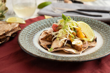 Grilled fish tacos with cabbage and lime