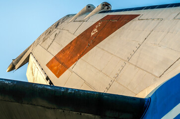 wings of a large soviet airliner against a blue sky