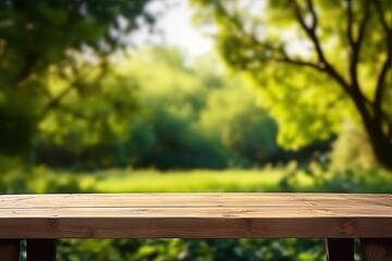 Fototapeta premium Rustic wooden table in nature. Blank board for summer and spring creations surrounded by greenery and bathed in sunlight