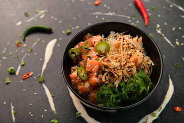 Raw salmon, Poké bowl with Wakame salad
