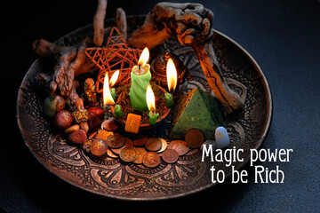 Magic power to be Rich. Witch altar with candles, old coins, stone runes, pentacle on dark table...