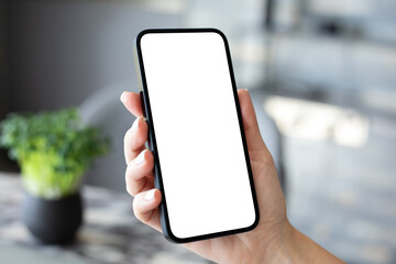 woman hand hold phone with isolated screen background of office - obrazy, fototapety, plakaty