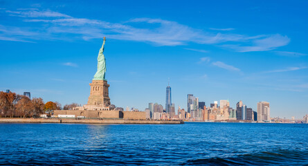 Statue of Liberty against Manhattan cityscape background in New York City, NY, USA