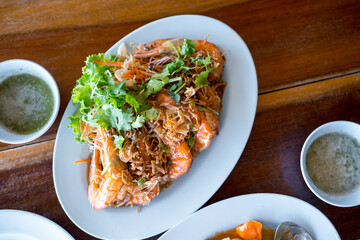Deep fried shrimp with tamarind sauce garnish with coriander