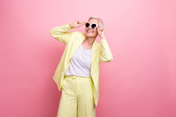 Photo of fashionista businesswoman wear yellow suit touching sunglasses look novelty accessories...