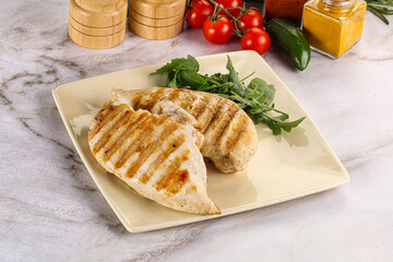 Grilled chicken breast served arugula