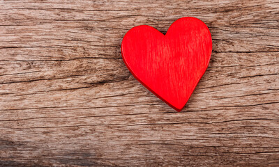 Fototapeta premium Wooden heart on wooden table