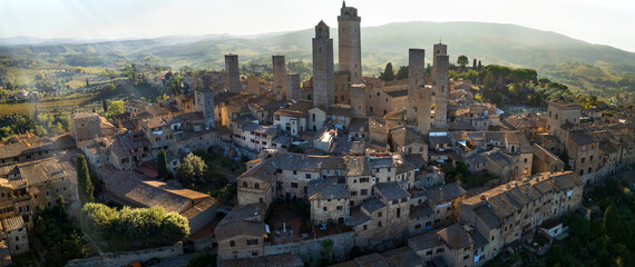 San Gimignano - one of the most beautiful medieval towns in Tuscany, Italy. aerial drone view of the towers in the morning light . Unesco heritage site..