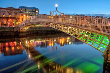The famous Ha'penny Bridge in Dublin, Ireland, at dusk - 693510487