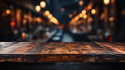Foto op Canvas An empty wooden table top with a blurred background © LOPH Studio