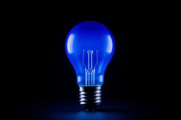 incandescent lamp, blue, isolated on black background